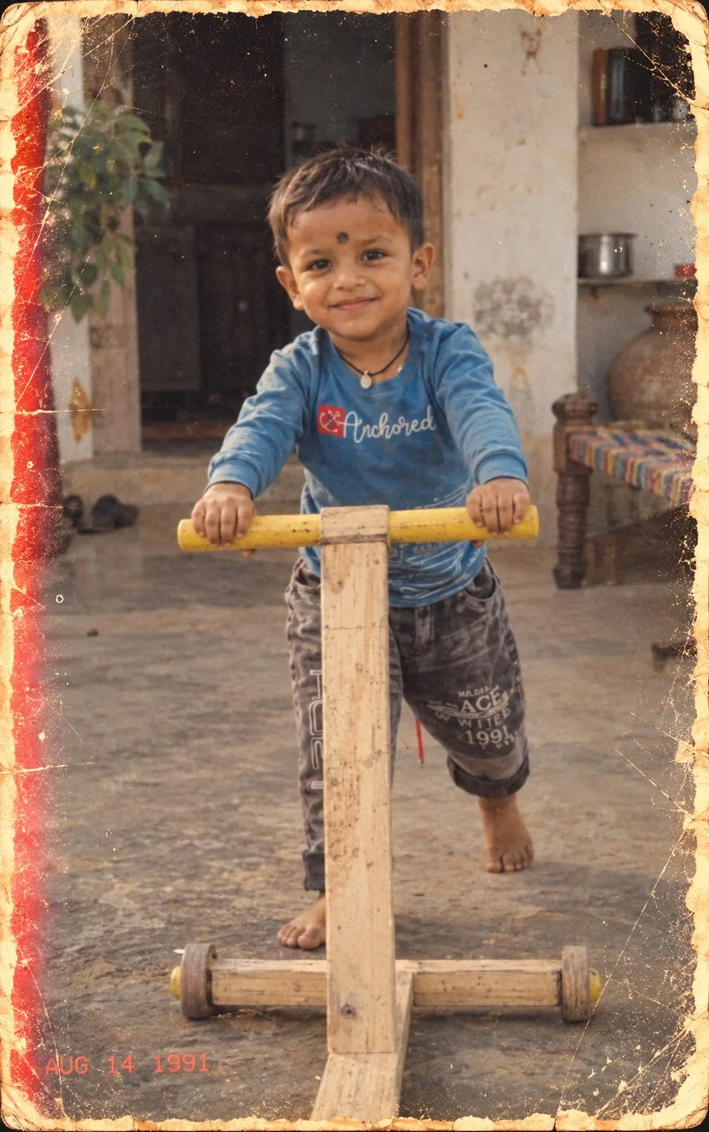 1990s Indian Boy with Wooden Push Toy Photo