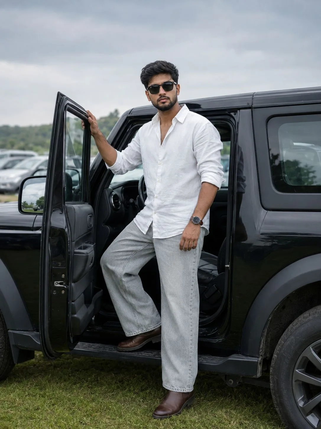 Indian Man Standing Beside a Black SUV