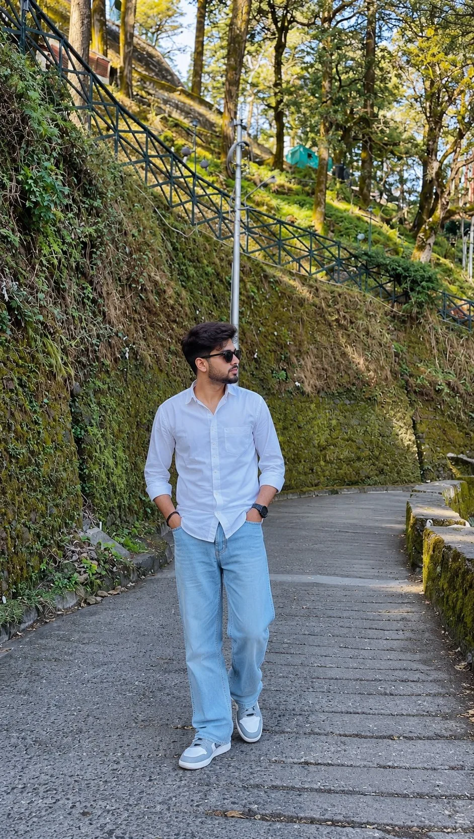 Young Man on a Forested Hillside Road